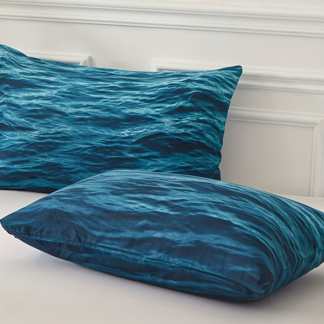 taies d'oreiller et vagues bleues